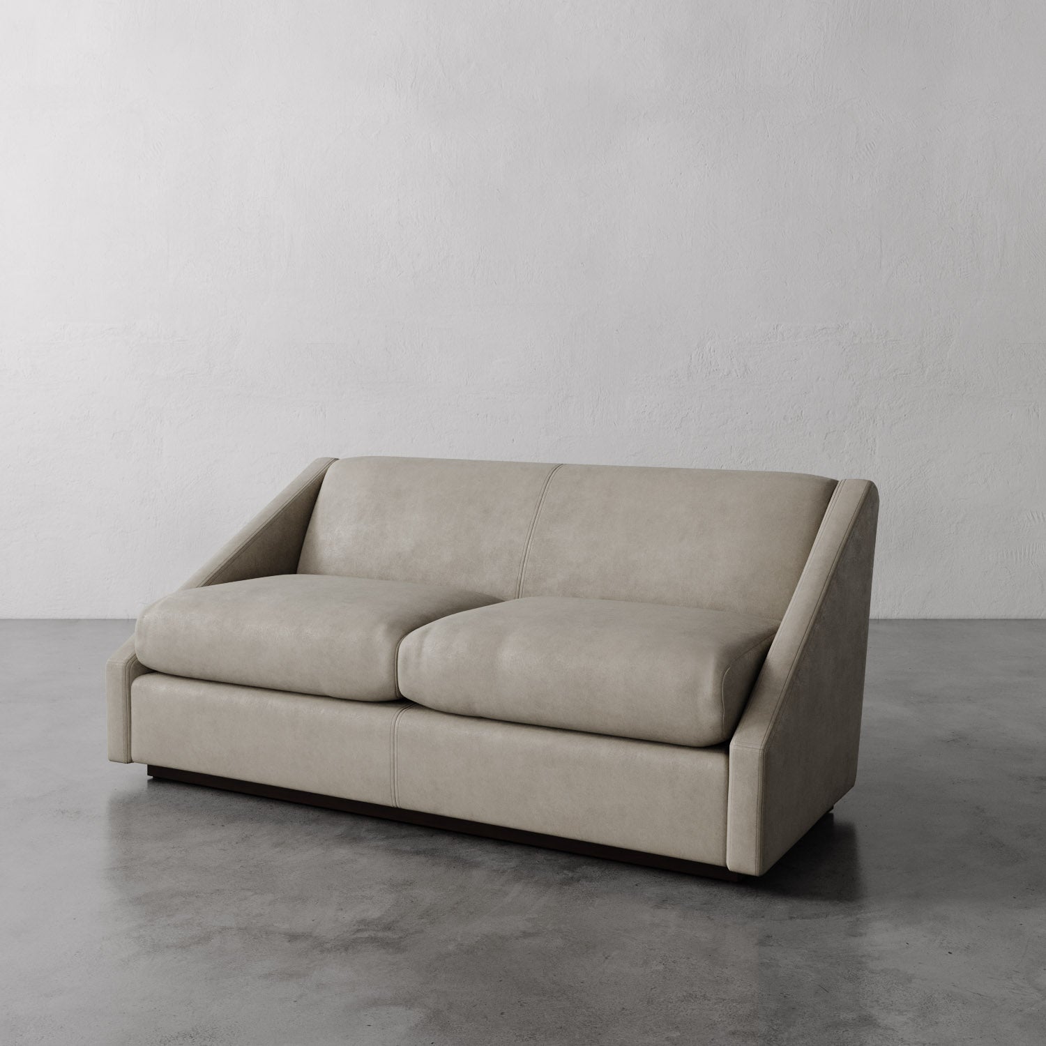 Lemieux Et Cie light gray Fontaine Leather Sofa on a gray floor with a plain white wall background