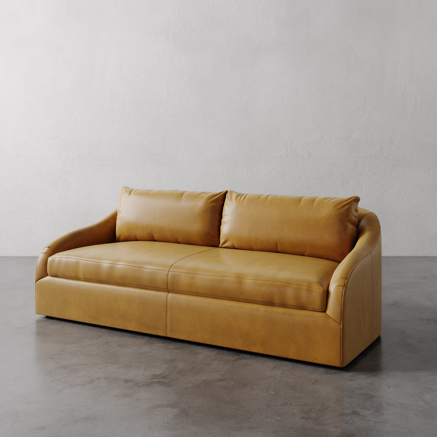 Lemieux Et Cie Tan Rousseau Leather Sofa on a gray floor with a plain white wall background.