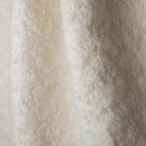 Nuvole Neige boucle upholstery fabric by Metaphores, part of Hermes' textile division, in snowy white