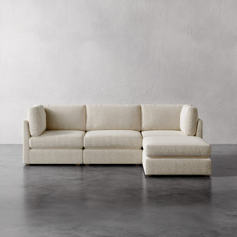 Lemieux Et Cie Chanaux 4-Pc Sectional
Beige sectional sofa on a gray floor with a plain white wall background