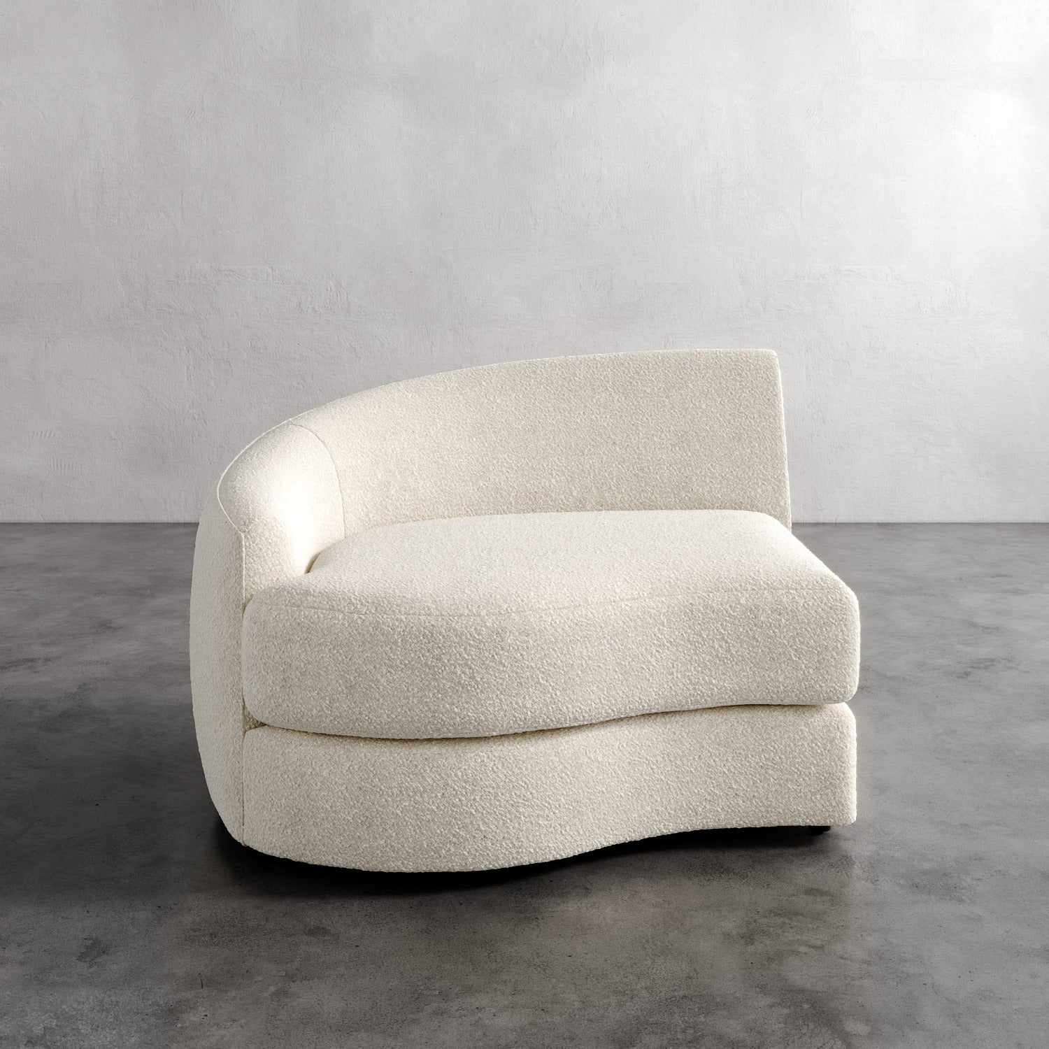 Lemieux Et Cie Rulmann Left Arm Chair Modern beige armchair on a gray floor with a neutral background