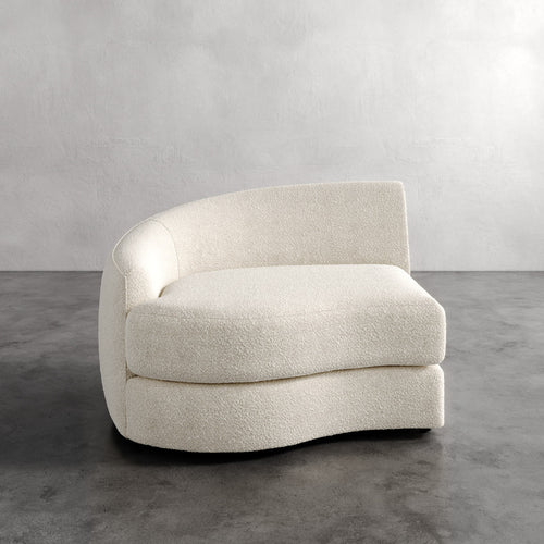 Lemieux Et Cie Rulmann Left Arm Chair Modern beige armchair on a gray floor with a neutral background