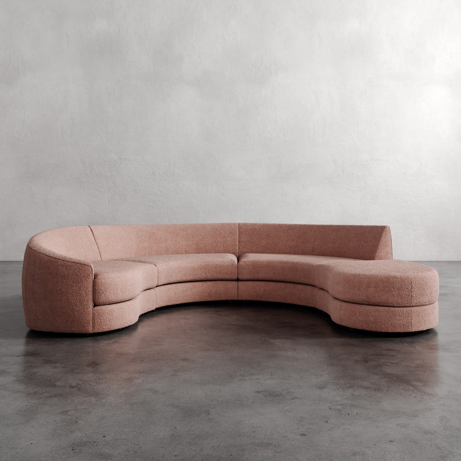 Lemieux Et Cie Rulmann 4-Piece Left Sectional Curved pink sofa on a gray floor with a neutral background