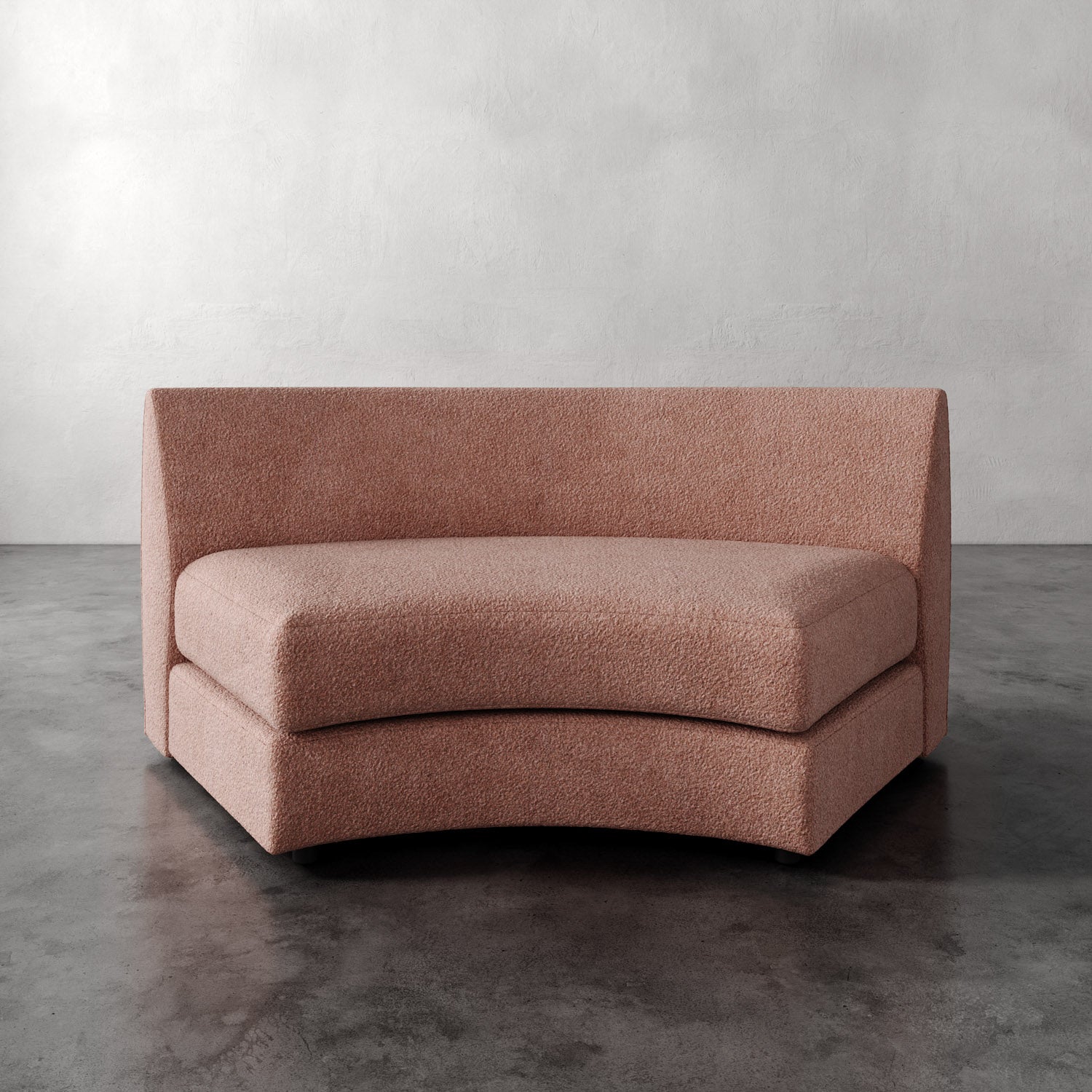 Lemieux Et Cie Rulmann Wedge Pink sofa against a gray wall