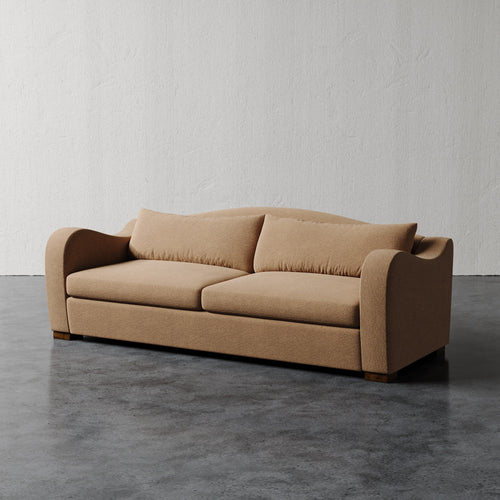 Lemieux Et Cie Elodie Sofa (Made-to-order) Beige sofa on a gray floor with a white wall background