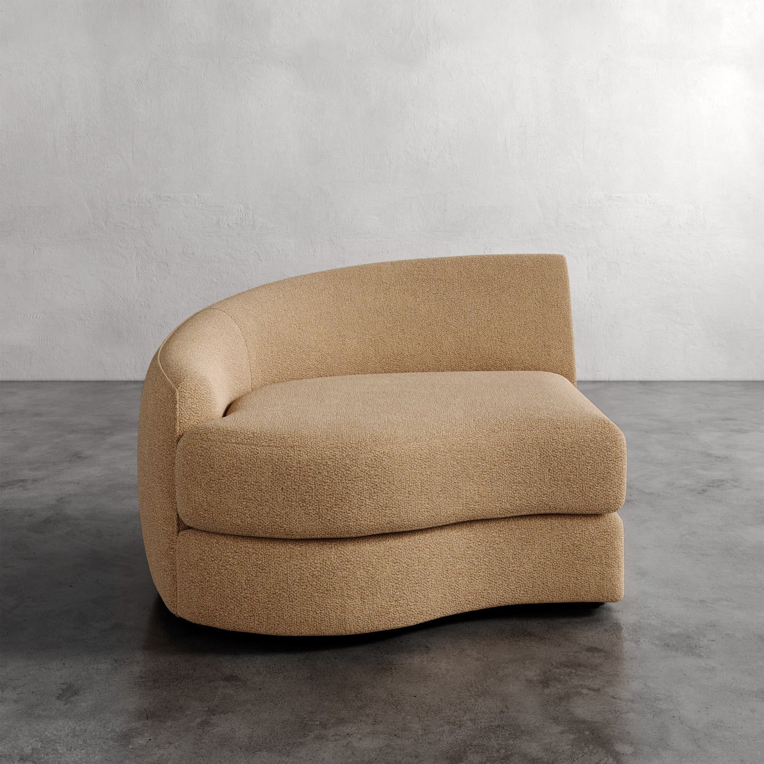 Lemieux Et Cie Rulmann Left Arm Chair Beige curved sofa on a gray floor with a neutral background