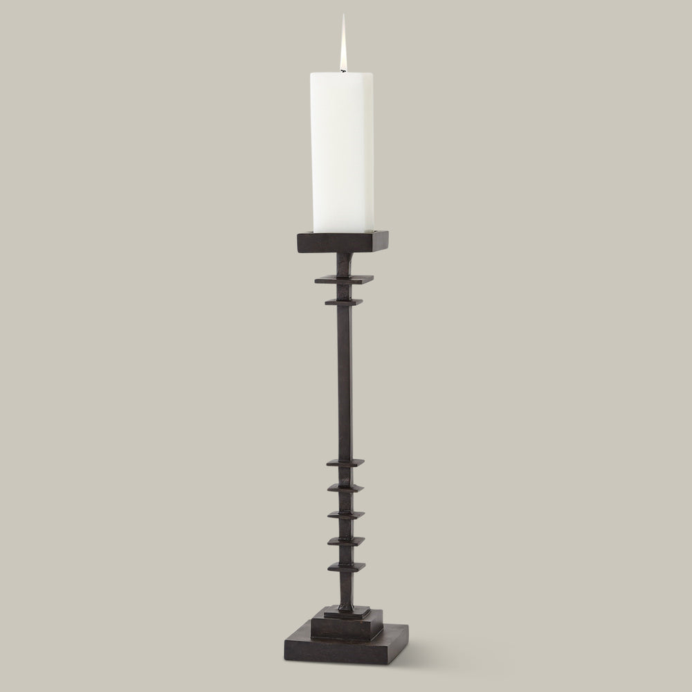 Lemieux et Cie Éloi Totem in dark wood and paper mache, tall sculptural candleholder with stacked geometric form, shown against neutral backdrop.