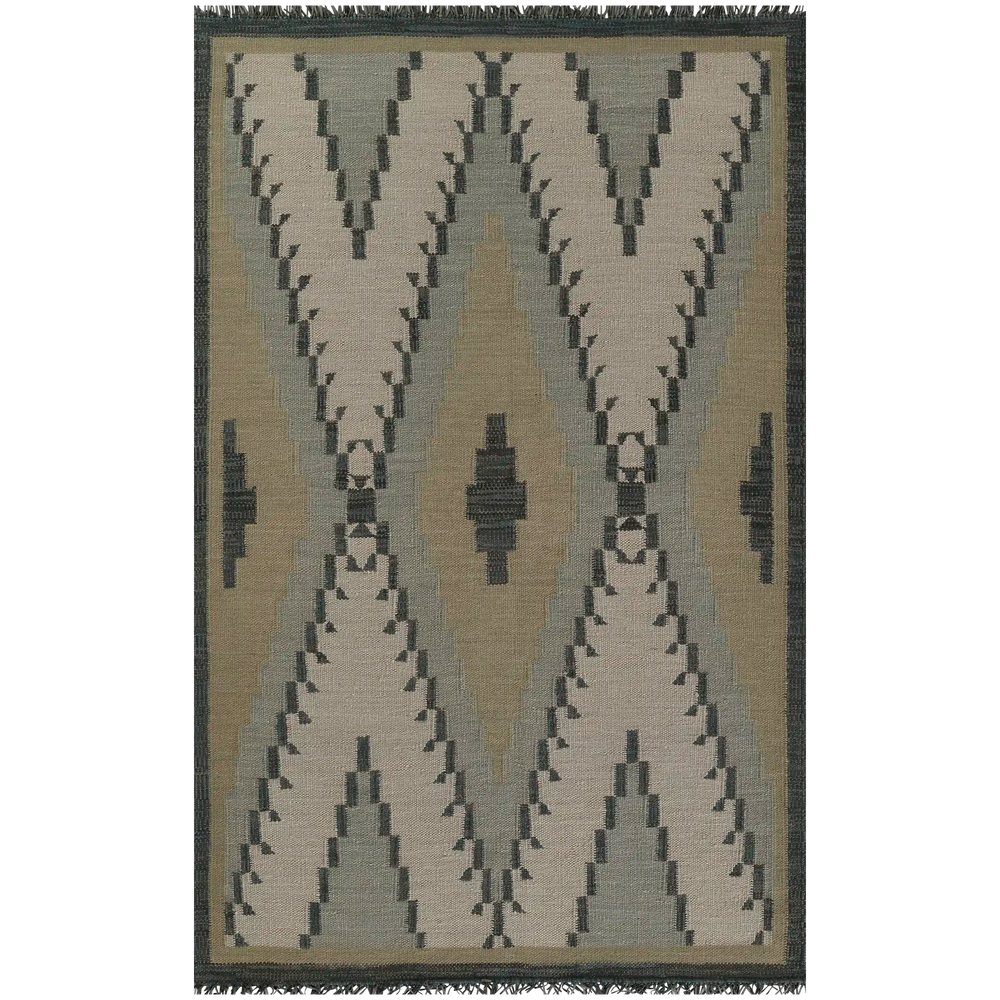 Lemieux et Cie handwoven rug in neutral taupe and charcoal geometric pattern with dark border and fringe, shown on white studio backdrop.