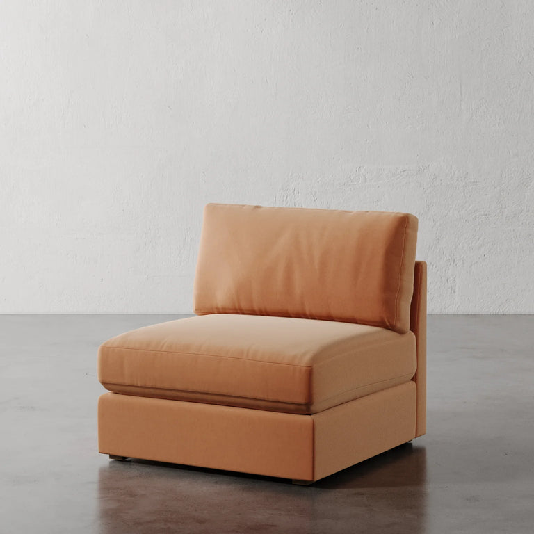 Lemieux Et Cie Chanaux Armless Chair
Orange armchair on a gray floor with a white textured wall background