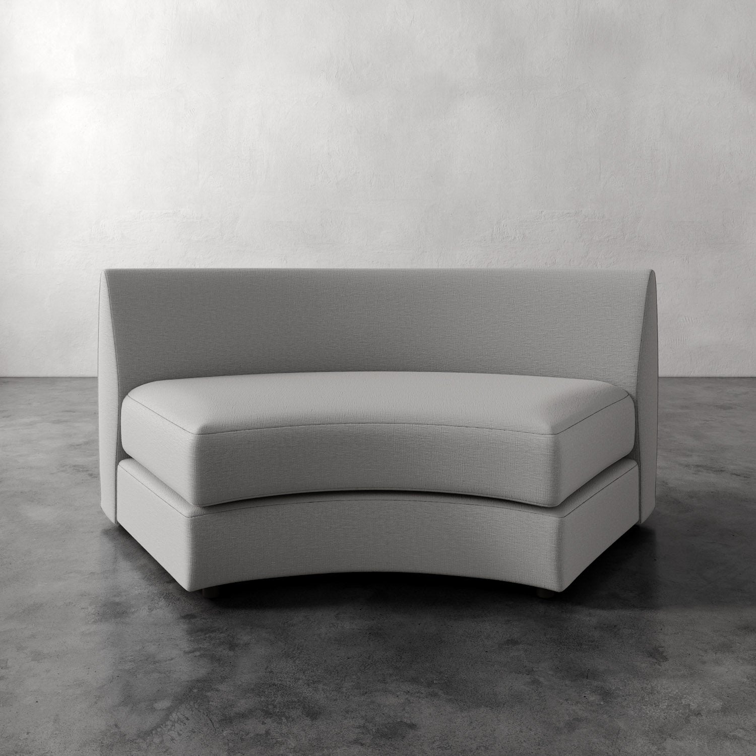 Lemieux Et Cie Rulmann Wedge Gray sofa on a concrete floor with a white wall background
