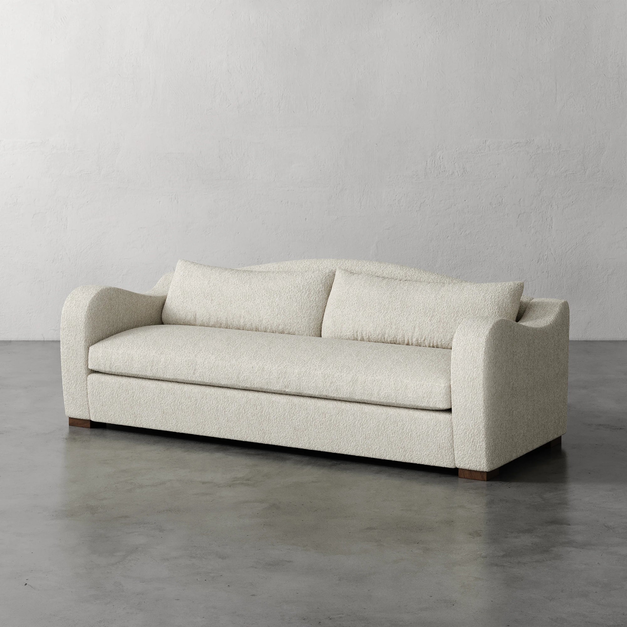 Lemieux Et Cie Elodie Sofa - Bench Seat (Made-to-order) Beige sofa on a gray floor with a plain gray wall background