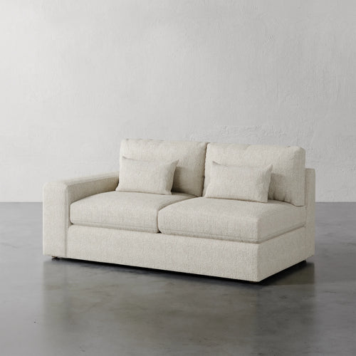 Lemieux Et Cie Lacroix Left or Right Arm Loveseat Beige sofa against a plain gray wall