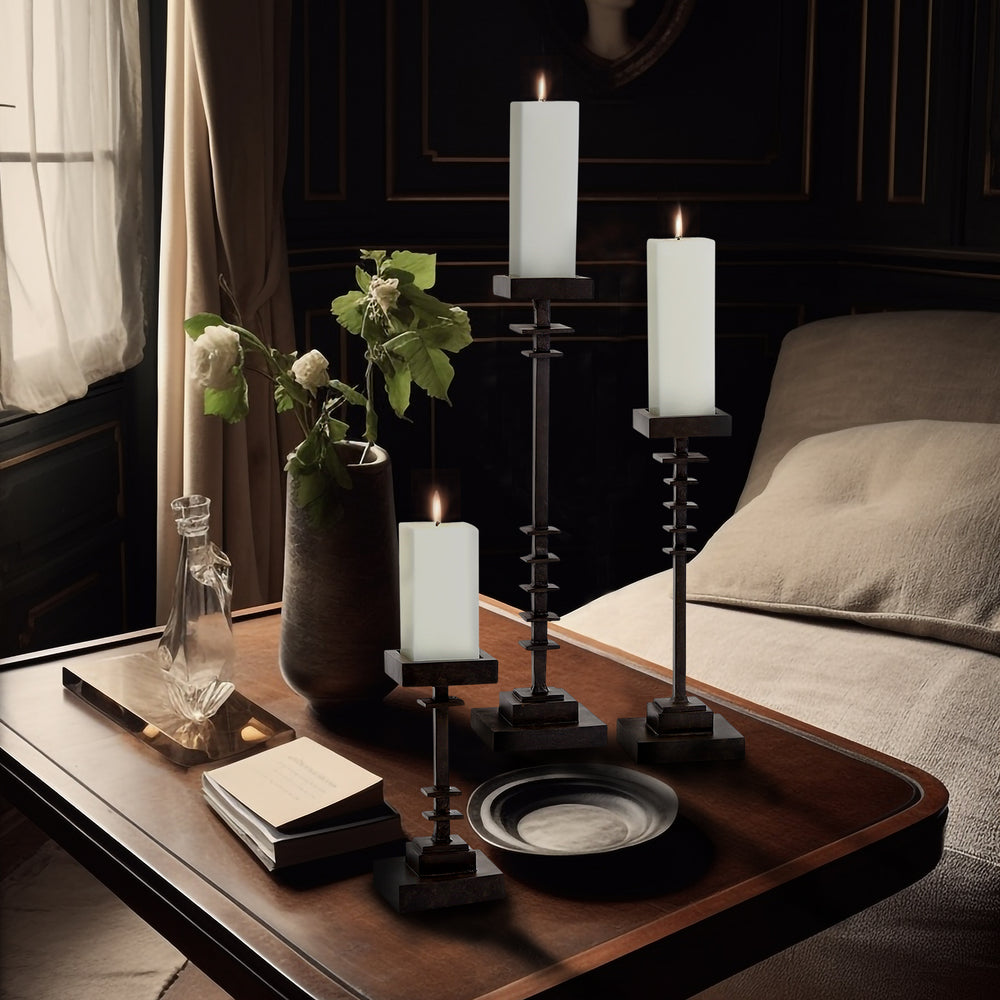 Lemieux et Cie Éloi Totem, hand-carved wood and paper mache sculpture in dark finish, styled on wood coffee table in sitting room with dark paneled walls.