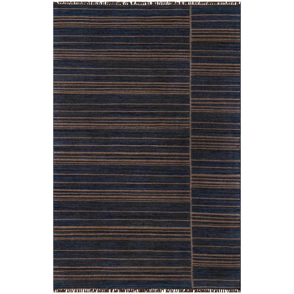 Lemieux et Cie Moghar Rug in navy and warm tan handwoven jute flatweave, striped pattern with organic texture, shown on white studio backdrop.
