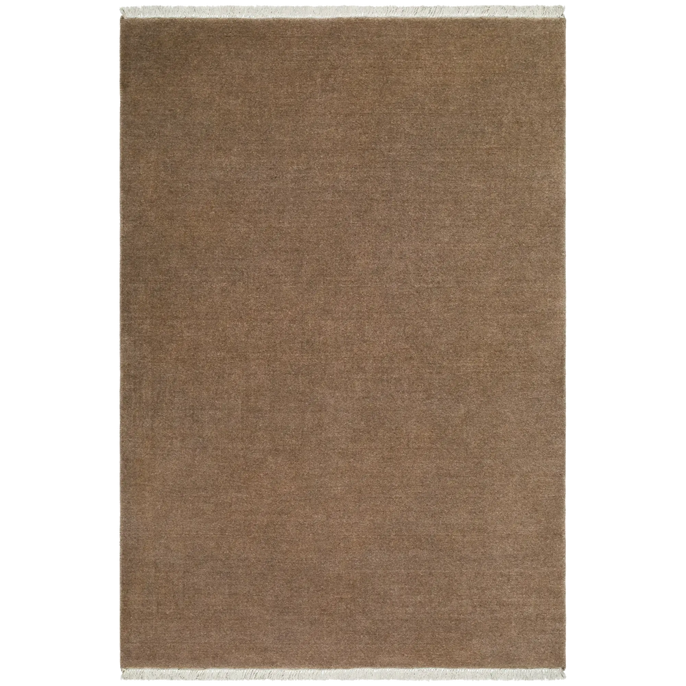 Lemieux et Cie Plume Handmade Wool Rug in desert tan, handloomed solid with fringe detail, shown on white studio backdrop.