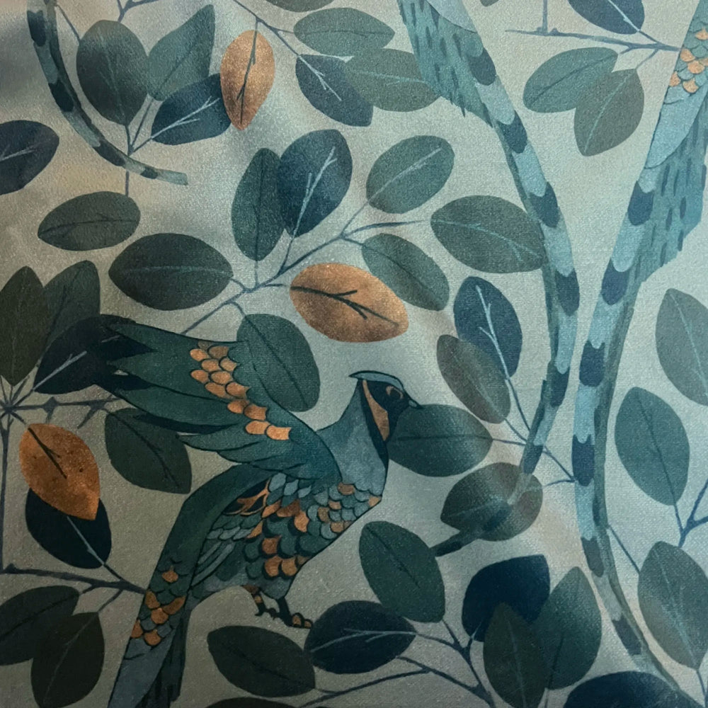 Lemieux et Cie Modern Peacock Velvet Pillow in teal and copper tones, performance velvet with stylized peacock and foliage motif, close detail.