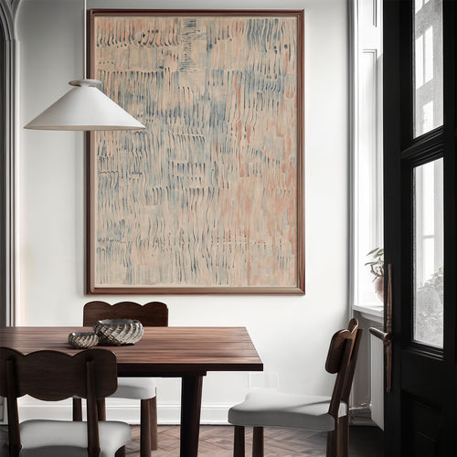 Lemieux et Cie Étretat Limited Edition Art Print in neutral tones, framed artwork above a dining table with dark chairs in a white-walled room with soft daylight.