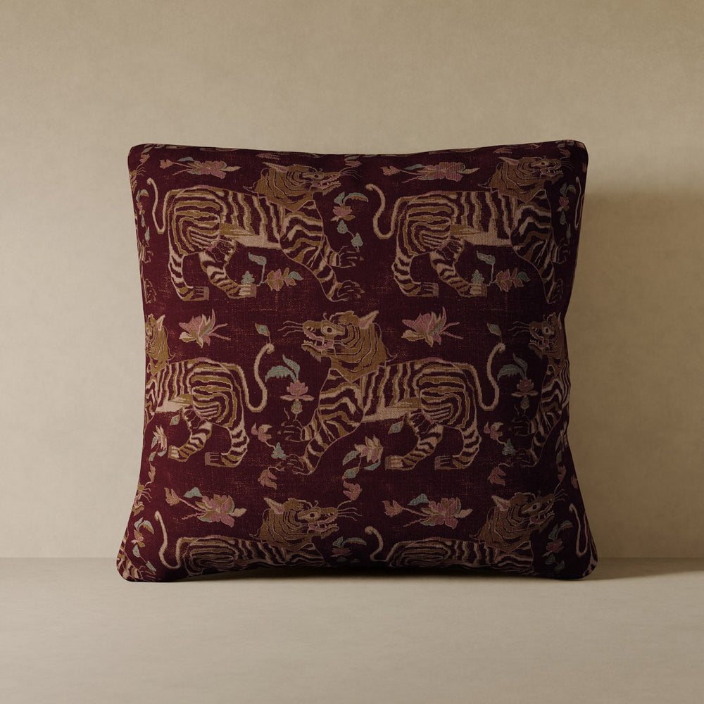 Lemieux et Cie Tiger Velvet Pillow in oxblood with woven tiger motif, decorative pillow shown against neutral wall on pale surface.