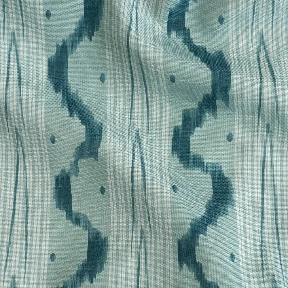 Lemieux et Cie Outdoor Pillow in Teal Ikat Waves, woven textile with organic wave pattern and ikat motifs in soft teal tones.