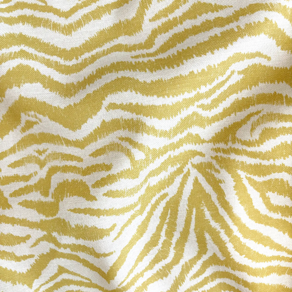 Lemieux et Cie Outdoor Pillow in Citron Zebra, decorative throw pillow with organic zebra stripe pattern in warm golden yellow and ivory tones.