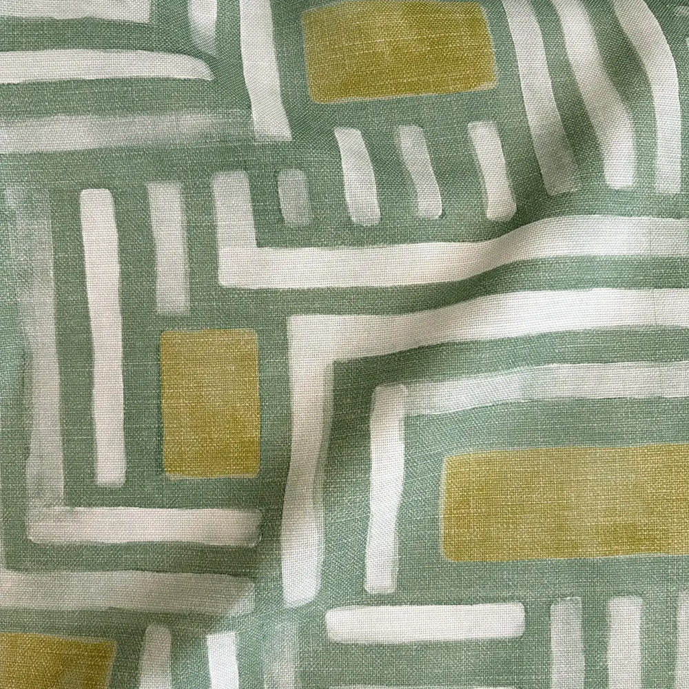 Lemieux et Cie Outdoor Pillow in Painterly Labyrinth pattern, geometric motif in sage green, ivory and golden olive with layered linework.