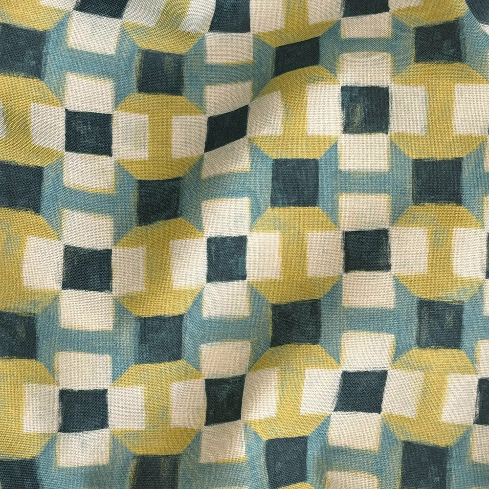 Lemieux et Cie Outdoor Pillow in Geometric Navy Citron, geometric abstract pattern in chartreuse, teal, ivory and dark blue, draped textile swatch.