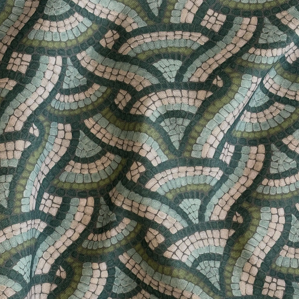 Lemieux et Cie Outdoor Pillow in Woven Mosaic pattern, geometric green and blue abstract design, close detail of draped textile surface.