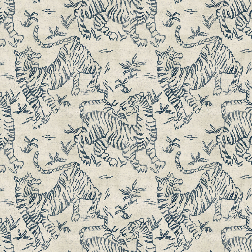 Lemieux et Cie Orly Tigers in indigo blue on ecru, handwoven rug with stylized tiger motif, shown on white studio backdrop.