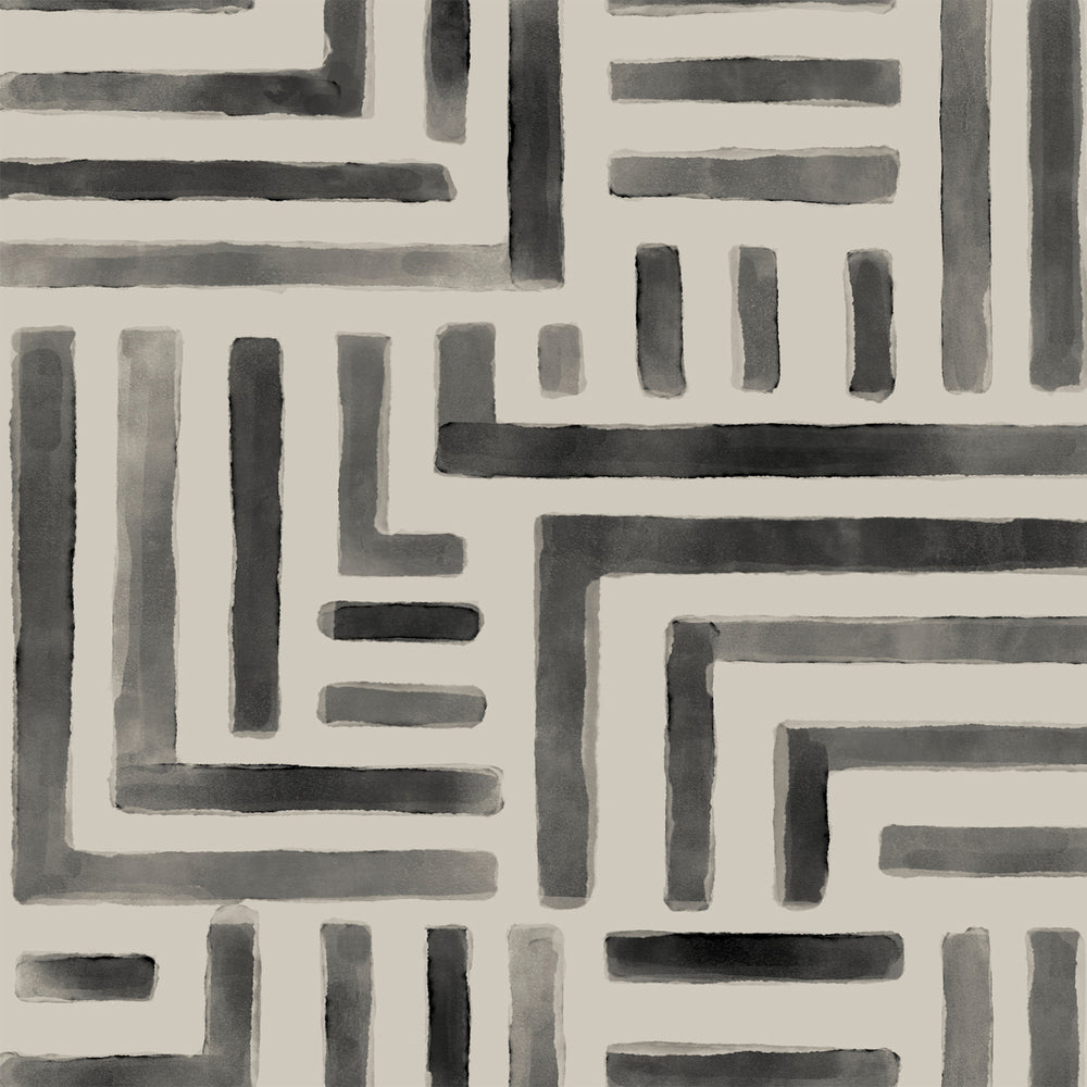 Lemieux et Cie Painterly Labyrinth rug in dark gray and beige, geometric maze pattern with watercolor effect on neutral cream ground.