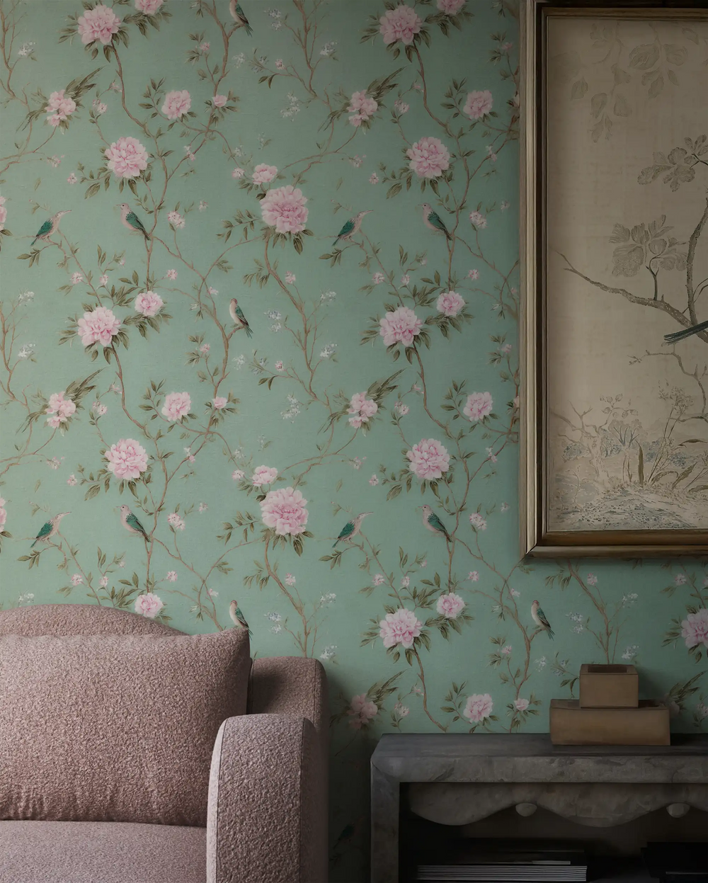 Lemieux et Cie Lucienne Blue Wallpaper in celadon with peonies and songbirds, peel and stick wallcovering shown in sitting room with framed art and blush upholstered seating.