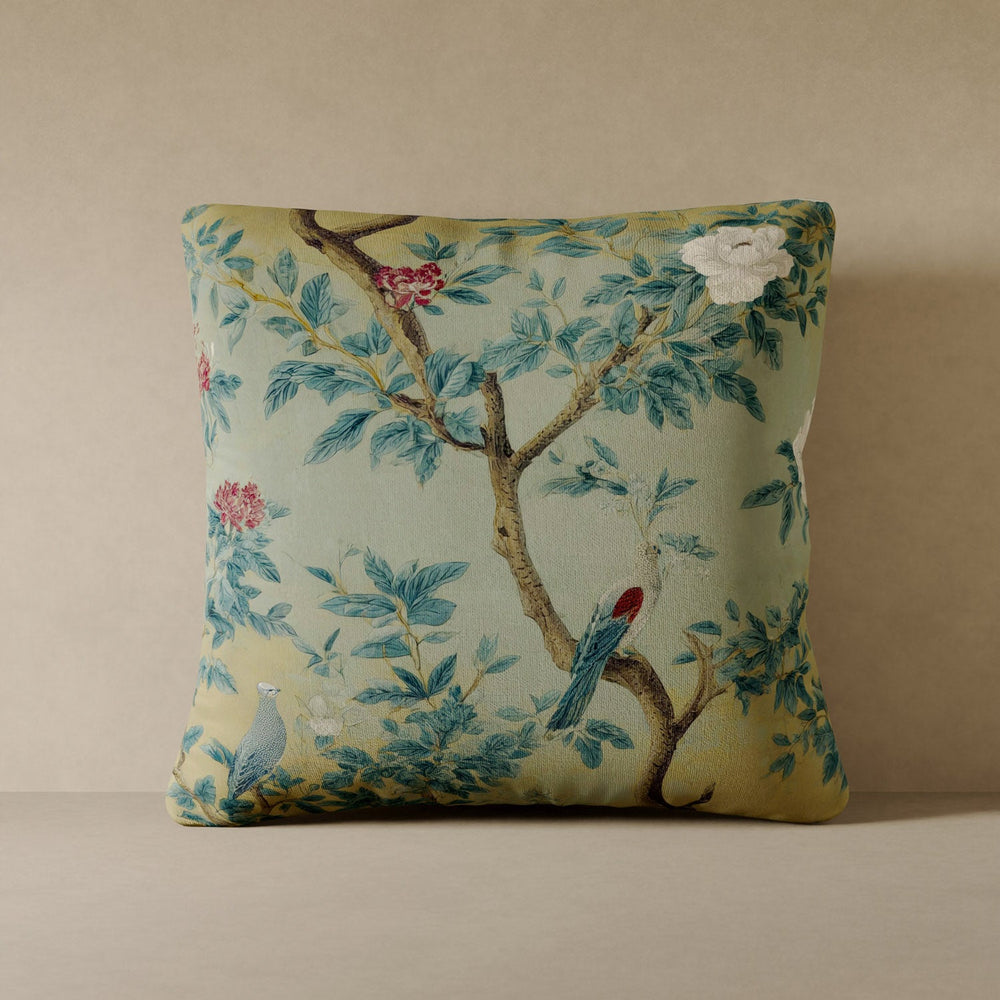 Lemieux et Cie Fresco Floral Velvet Pillow in pale yellow with botanical motif, decorative cushion shown against warm neutral wall and stone surface.