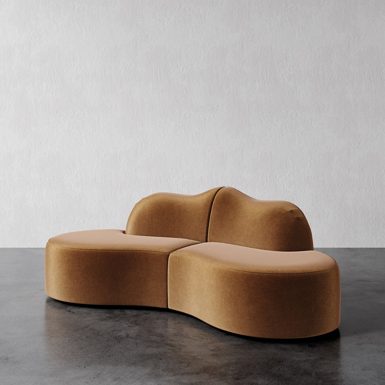 Lemieux Et Cie Serpentine 2-Piece Sectional Brown modern sofa on a gray floor with a white wall background