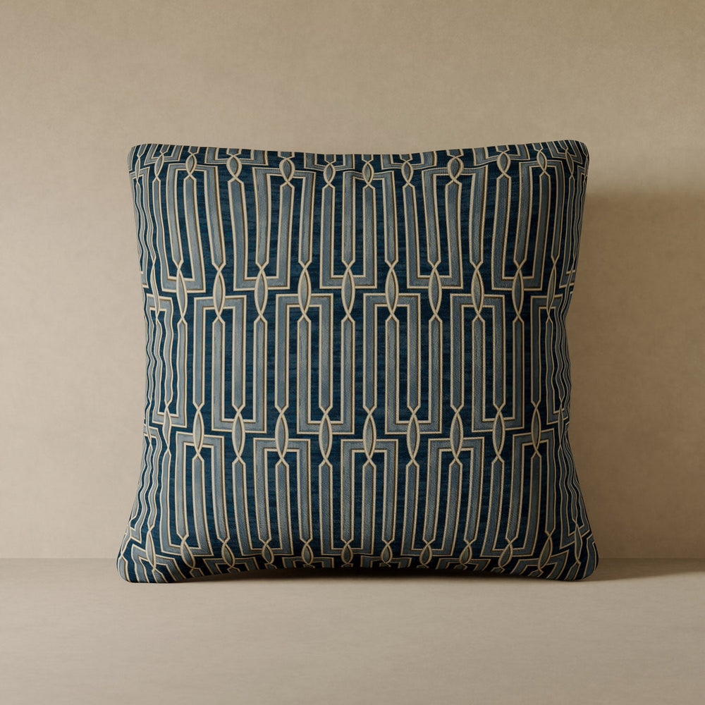 Lemieux et Cie Arbus Stripe Velvet Pillow in blue geometric pattern, square performance velvet cushion shown against neutral plaster wall.