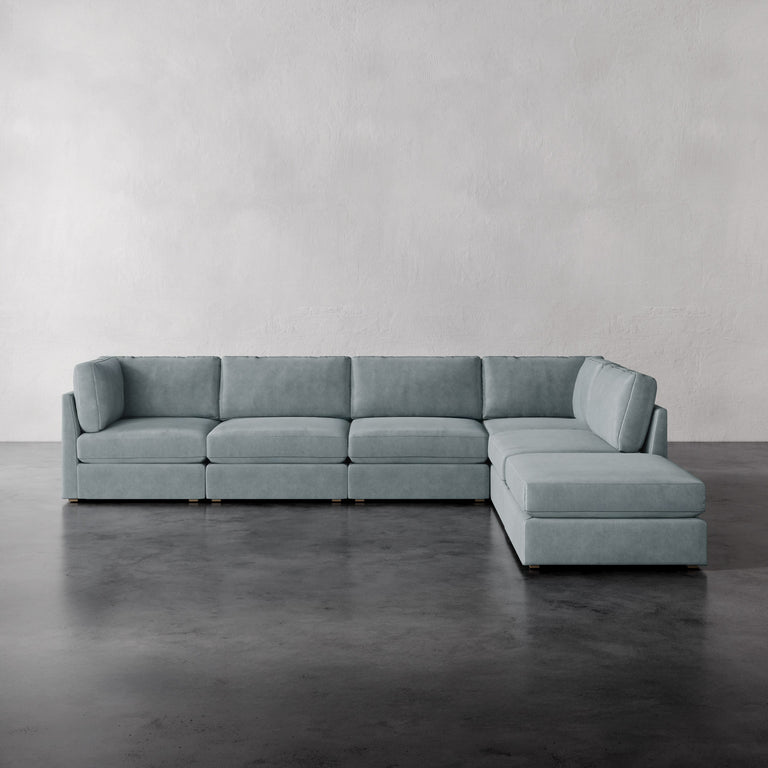 Lemieux Et Cie Chanaux 6-Pc Sectional
Light blue sectional sofa on a gray floor with a plain gray wall background