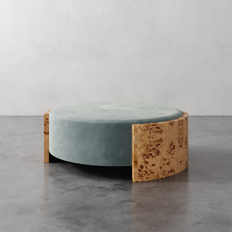 Lemieux et Cie Benoit Coffee Table Ottoman in sage velvet and wire-brushed quarter-sawn oak, low-profile curved ottoman on polished concrete floor.