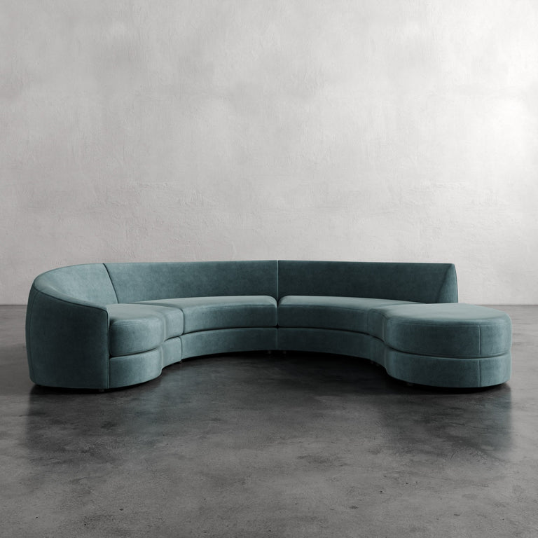 Lemieux Et Cie Rulmann 4-Piece Left Sectional Curved teal sofa against a plain wall