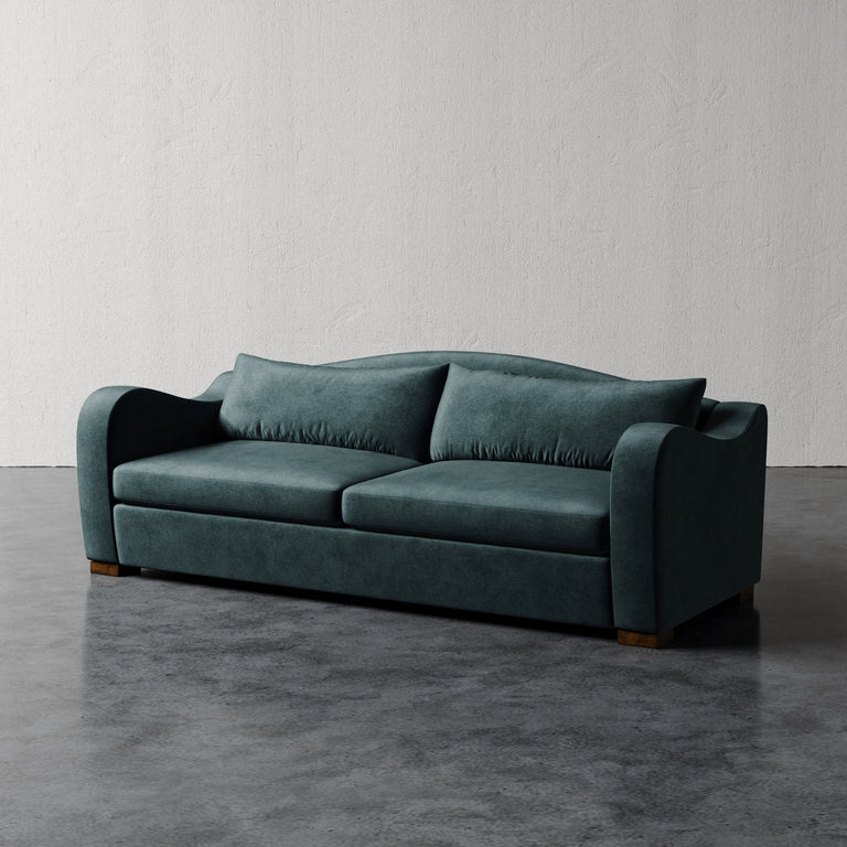 Lemieux Et Cie Elodie Sofa (Made-to-order)Blue sofa on a gray floor with a white wall background