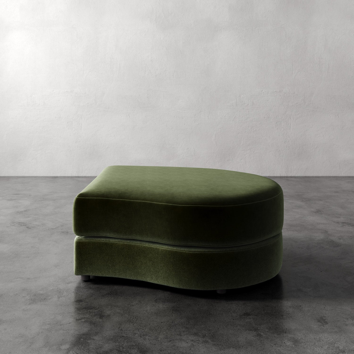 Lemieux Et Cie Rulmann Right Ottoman Green ottoman on a gray floor with a white wall background
