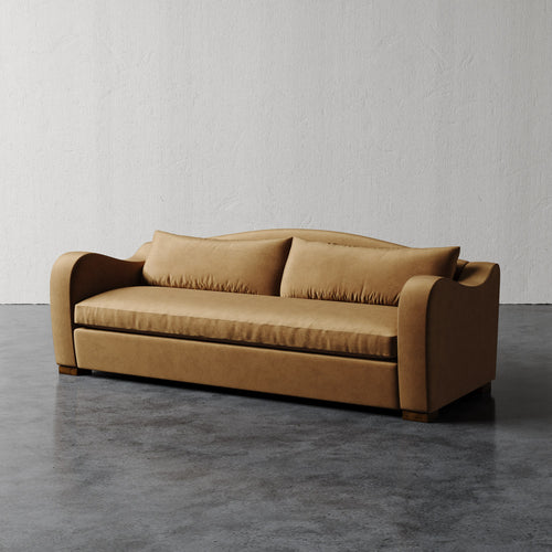 Lemieux Et Cie Elodie Sofa - Bench Seat (Made-to-order) Brown sofa on a gray floor with a white wall background