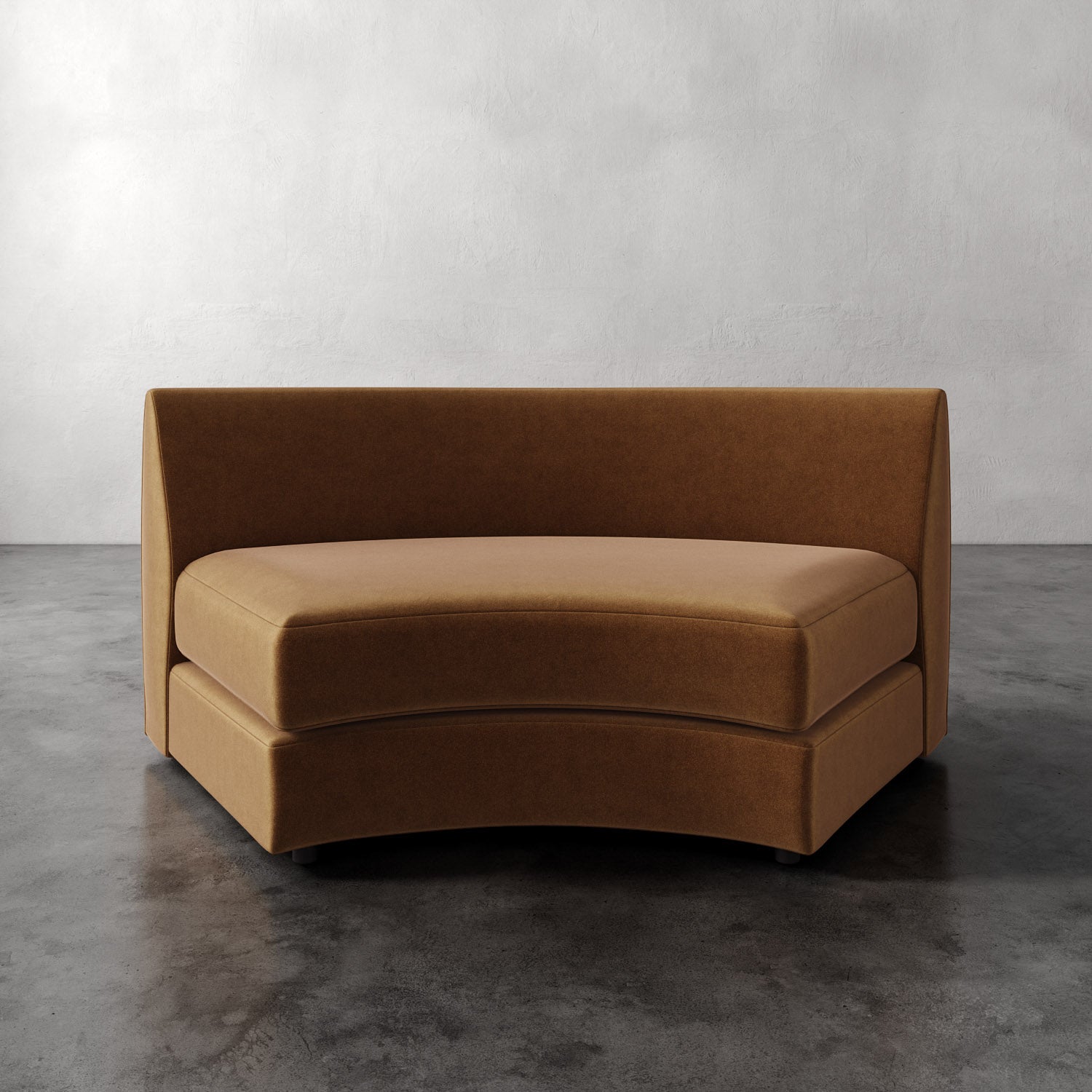 Lemieux Et Cie Rulmann Wedge Brown curved sofa against a plain wall.