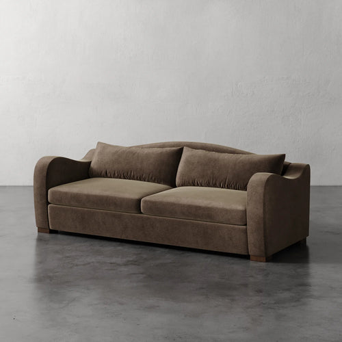 Lemieux Et Cie Elodie Sofa (Made-to-order) Brown sofa on a gray floor with a white wall background