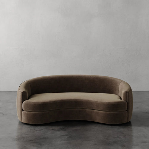 Lemieux Et Cie Rulmann Sofa Brown curved sofa against a gray wall