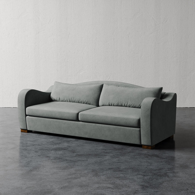 Lemieux Et Cie Elodie Sofa (Made-to-order) Gray sofa on a gray floor with a white wall background