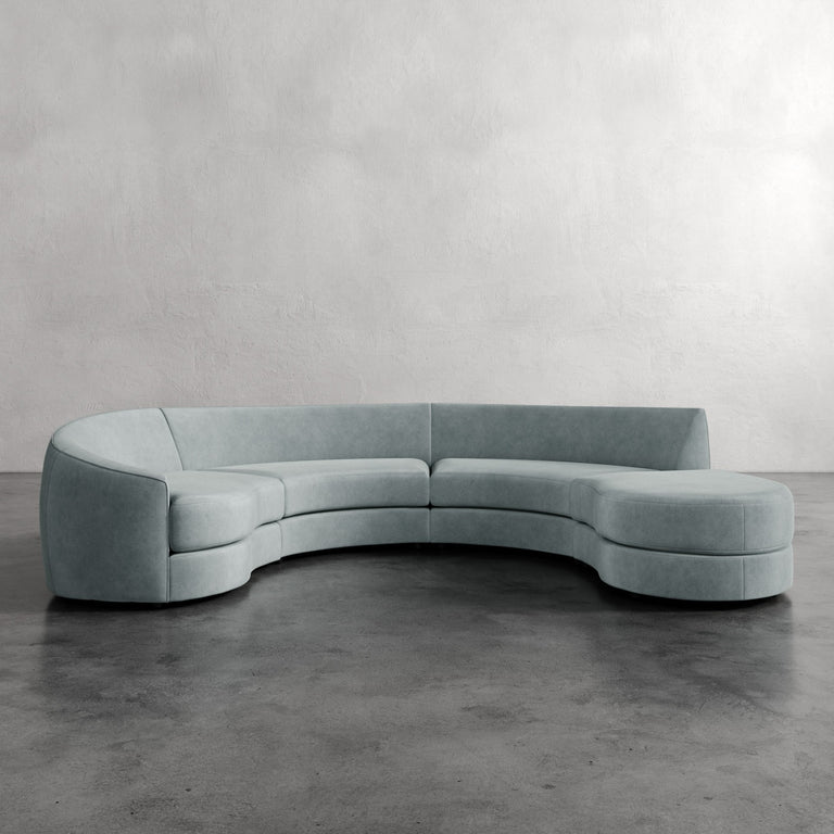 Lemieux Et Cie Rulmann 4-Piece Left Sectional Modern curved sofa in a minimalistic setting with a plain background