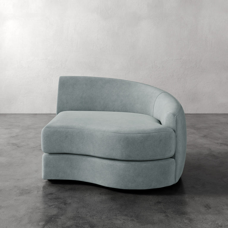 Lemieux Et Cie Rulmann Right Arm Chair Modern light blue sofa against a plain wall