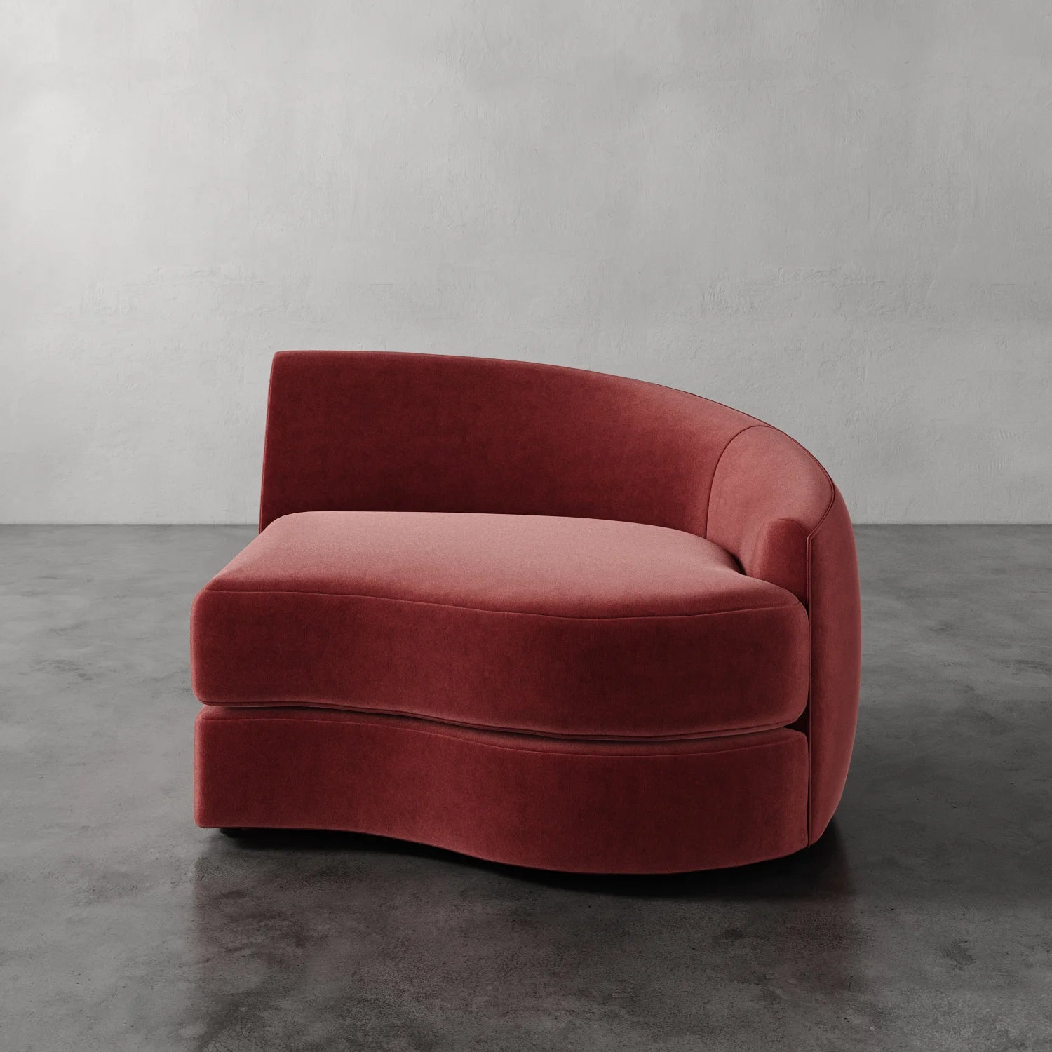 Lemieux Et Cie Rulmann Right Arm Chair Red curved sofa against a gray wall