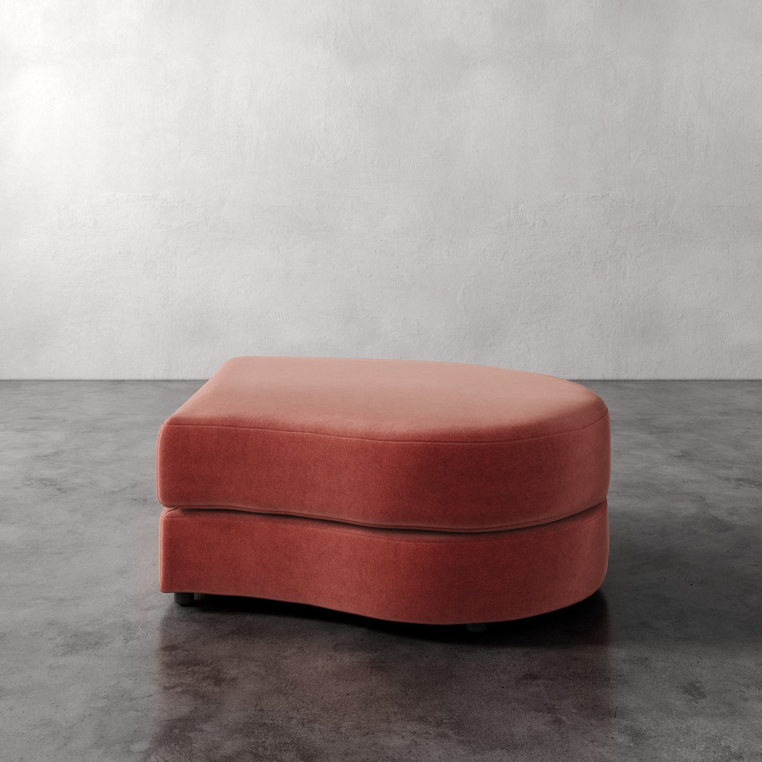 Lemieux Et Cie Rulmann Right Ottoman Red cushioned ottoman on a gray floor with a white wall background