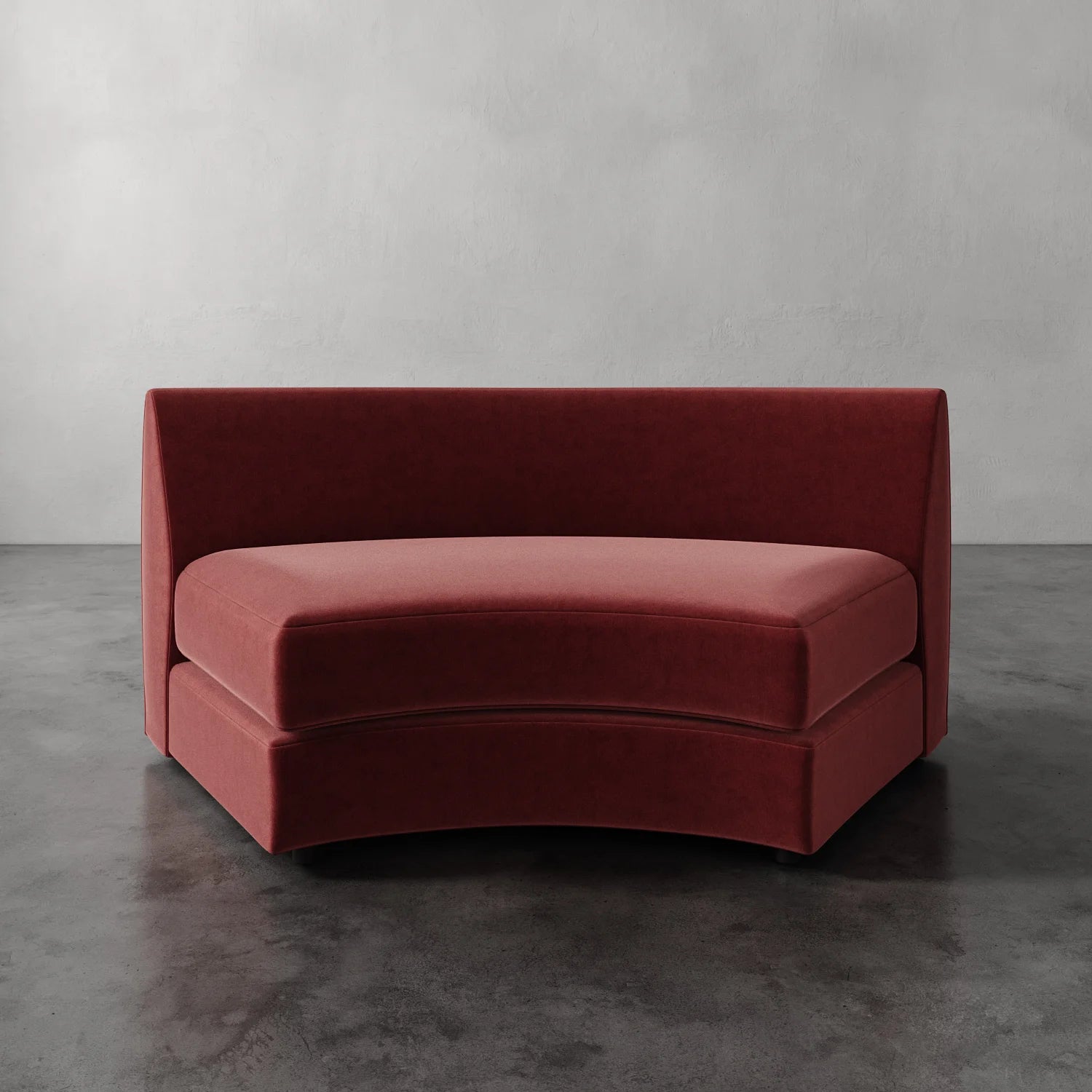 Lemieux Et Cie Rulmann Wedge Red curved sofa against a gray background