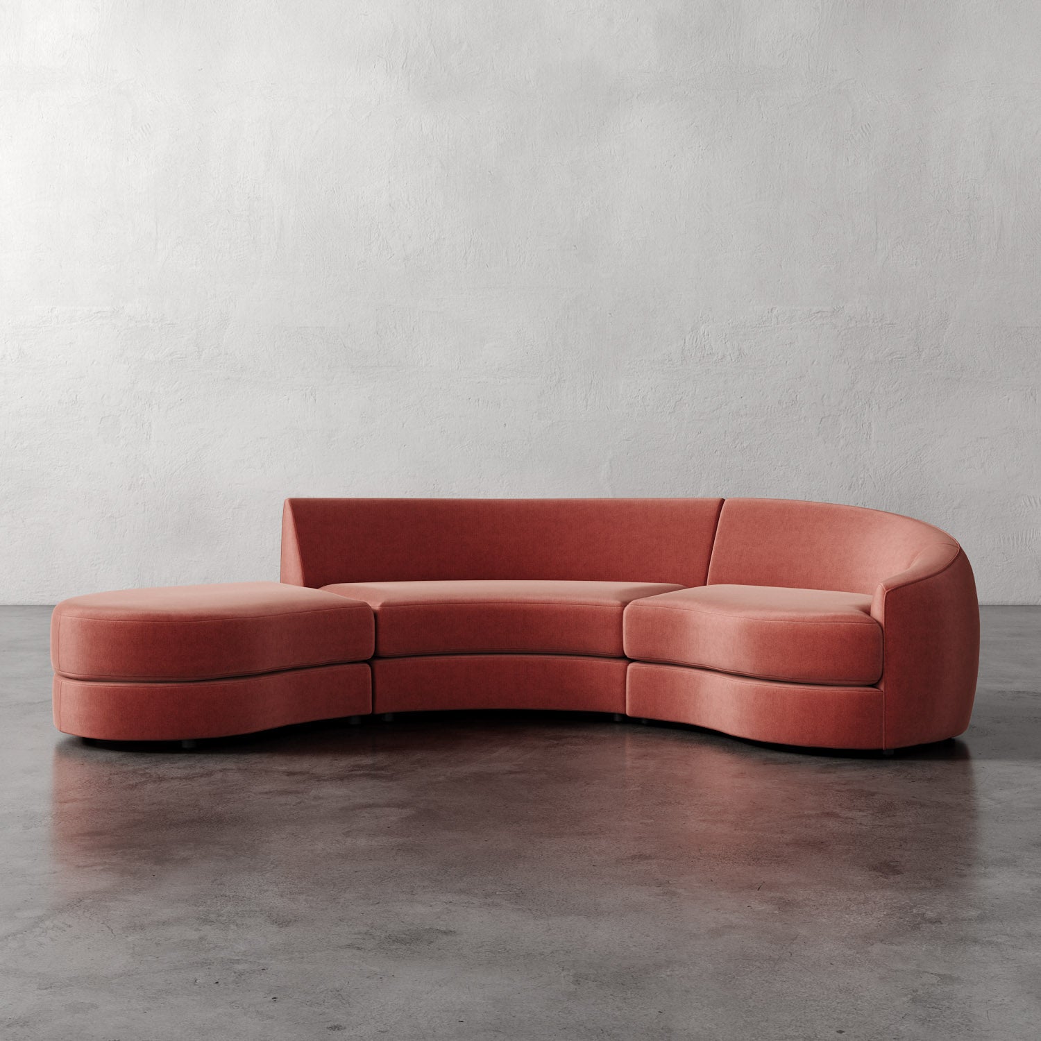 Lemieux Et Cie Rulmann 3-Piece Right Sectional Curved pink sofa on a gray floor with a plain white wall background