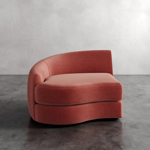 Lemieux Et Cie Rulmann Left Arm Chair Modern pink sofa against a gray wall
